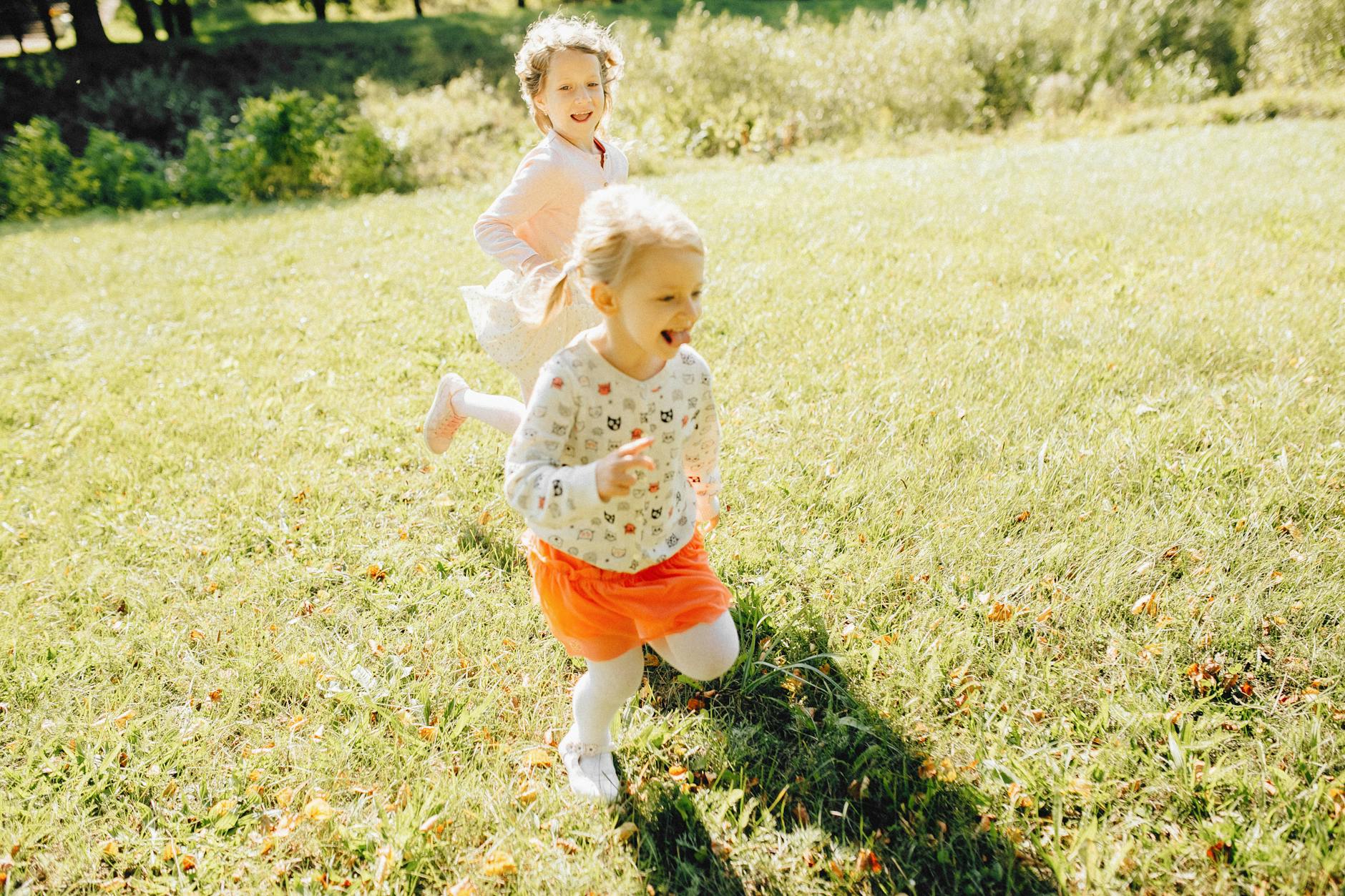 little girls playing at a park